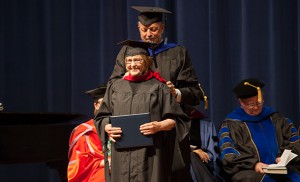 Michael King, seminary dean, hoods Rosemary King,, of Harrisonburg, Va., She earned a Master of Divinity degree.