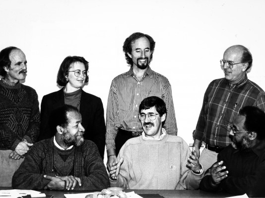 Seven who attended a strategic planning meeting in 1995 for EMU's fledgling Conflict Transformation Program: (from left, standing) Paul Stucky, Ruth Zimmerman, Ron Kraybill, Vernon Jantzi. (Seated) Ricardo Esquivia, John Paul Lederach, Hizkias Assefa.