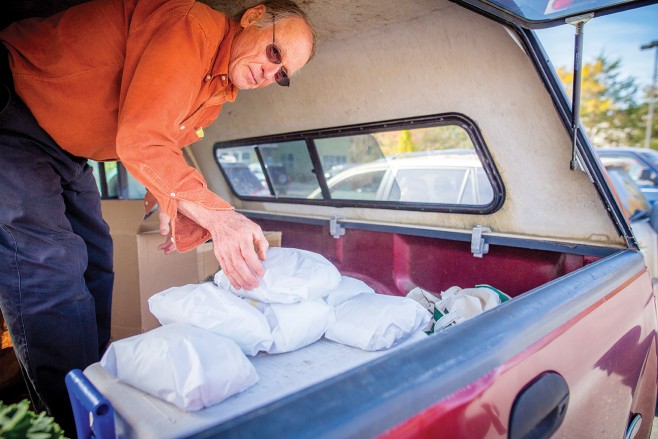 About every six weeks, Bob Gillette grinds 100 pounds of flour and bakes loaves of sourdough bread in earthen ovens to give away to friends and neighbors. 