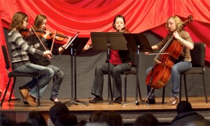 A string ensemble - Meg Smeltzer, first violin; Heather Tieszen, second violin; Briana Eshleman, viola; and Ellie Cook, cello, offers a prelude at the opening convocation of EMU's second (spring) semester.