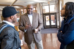 EMU alumnus the Rev. Leonard Dow (center) talks to EMU sophomores Amin Laboriel (left) and Jossimar Diaz-Castro after his talk during EMU’s Spiritual Life Week. (Photo by Nikki Fox)
