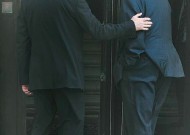 martin-mcguinness-and-ian-paisley Former “enemies” -- Martin McGuinness at left, an IRA (Catholic) leader, and Ian Paisley, a DUP (Protestant) leader -- enter Stormont where the Parliament of Northern Ireland meets as they begin their power-sharing leadership roles. Photo by Hugh Russell, Irish News.