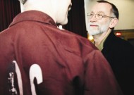 A Department of Corrections inmate chats with Howard Zehr, who has done considerable restorative justice work within prisons
