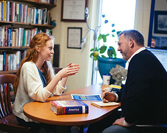 Mark Metzler Sawin talking to a student