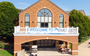 campus center with a "welcome to campus" banner