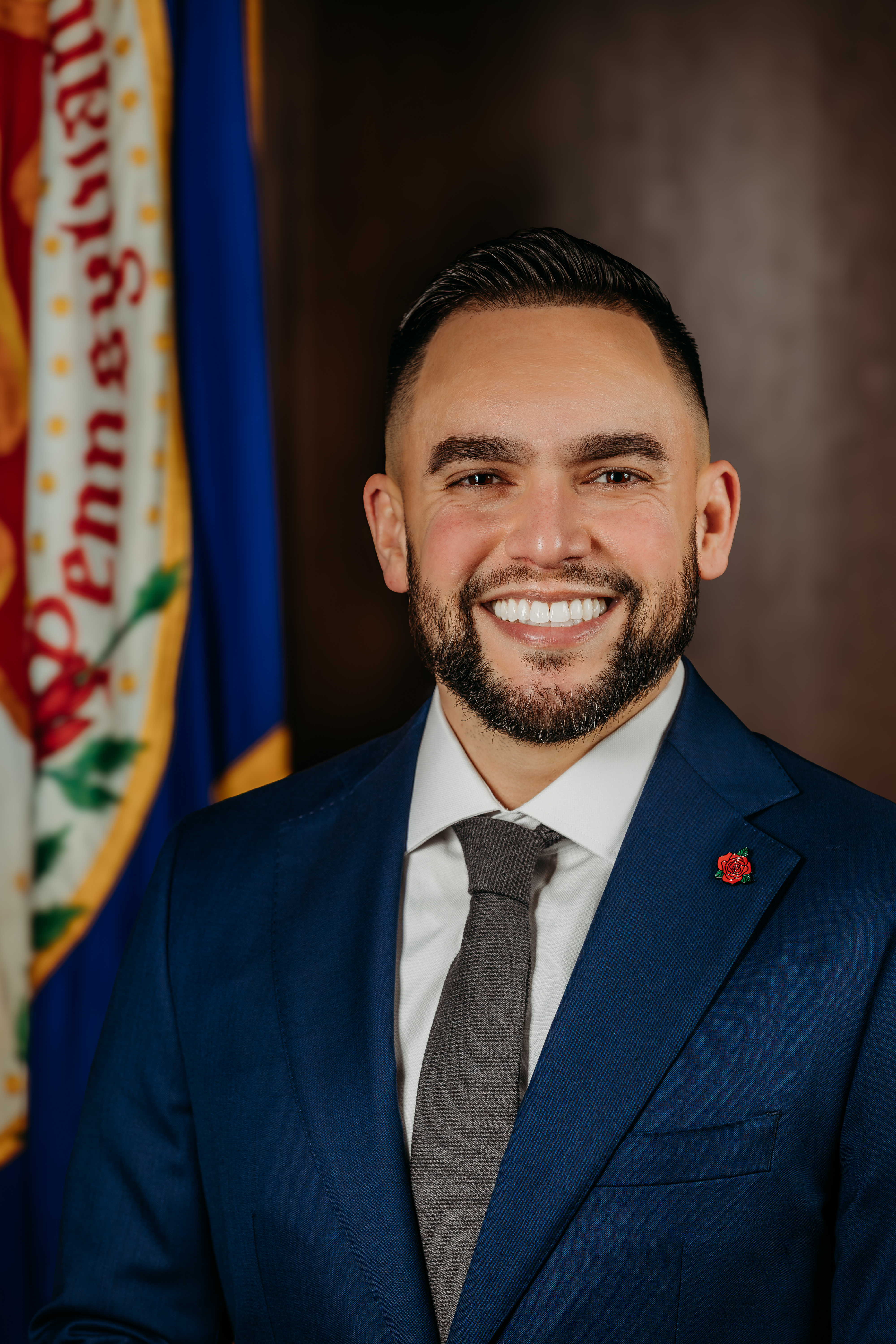 Jaime Arroyo, Mayor of Lancaster Pennsylvania, posing in front of flag