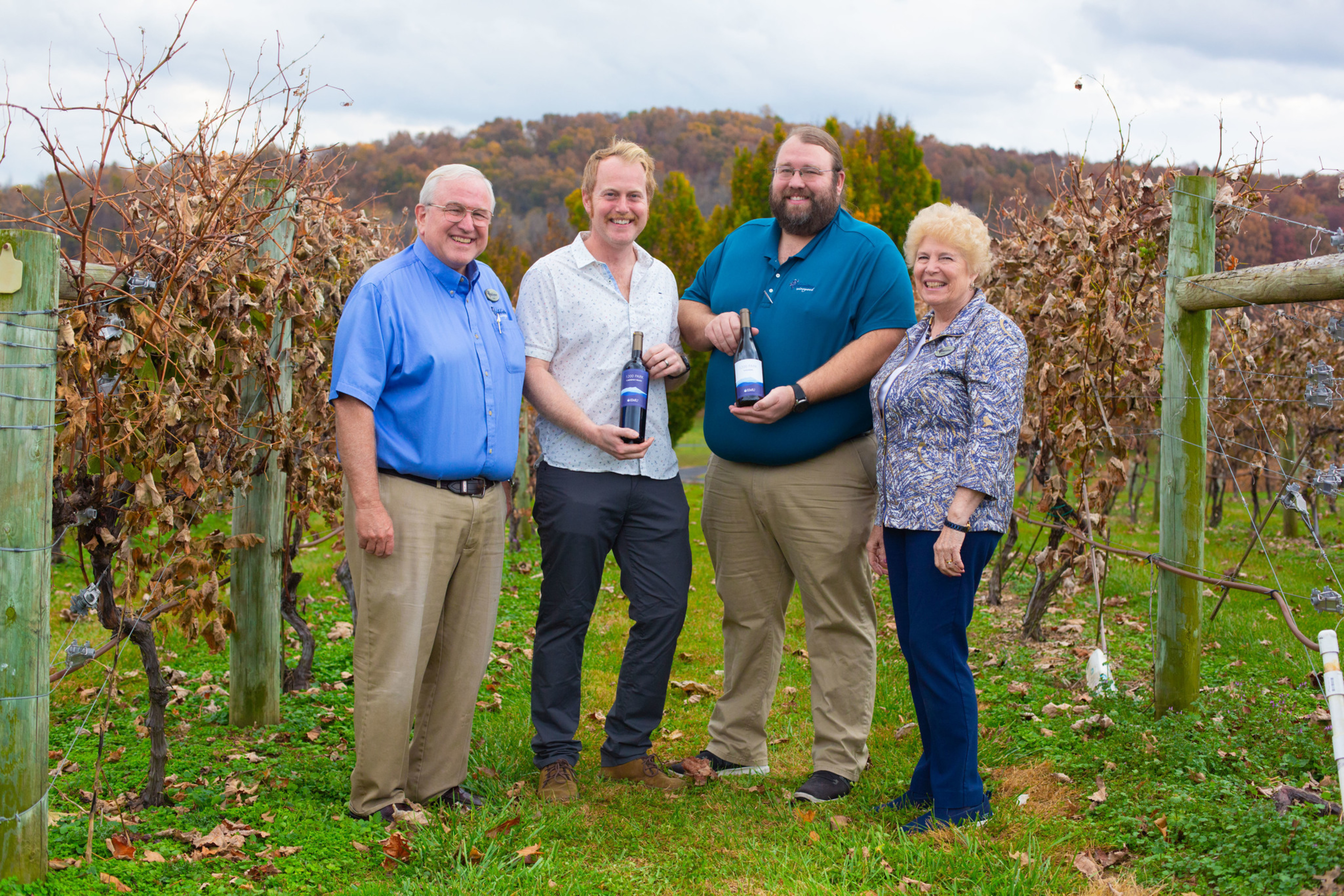 four people pose at Bluestone Vineyard