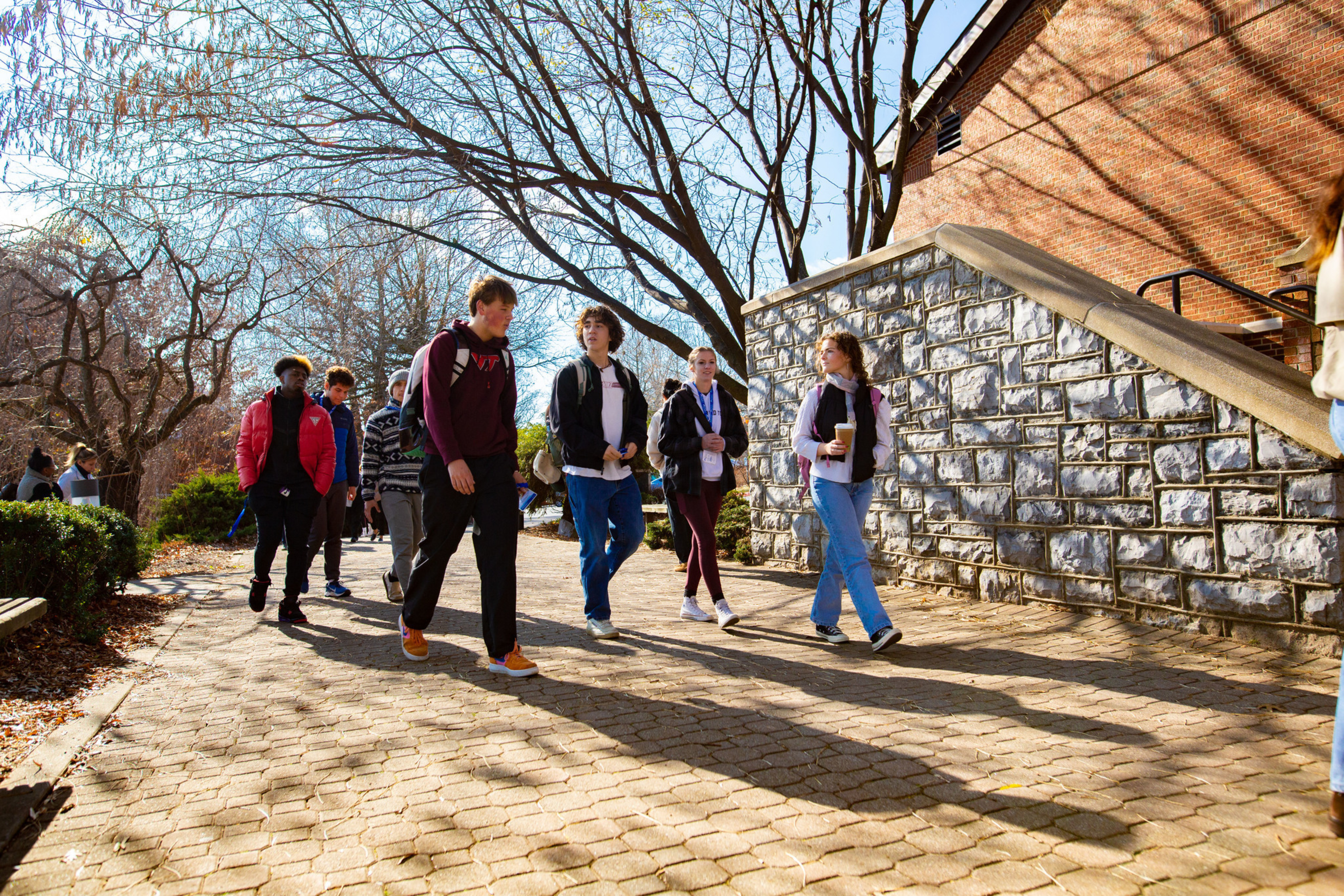 students walk around campus