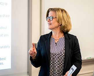 woman in front of a white board