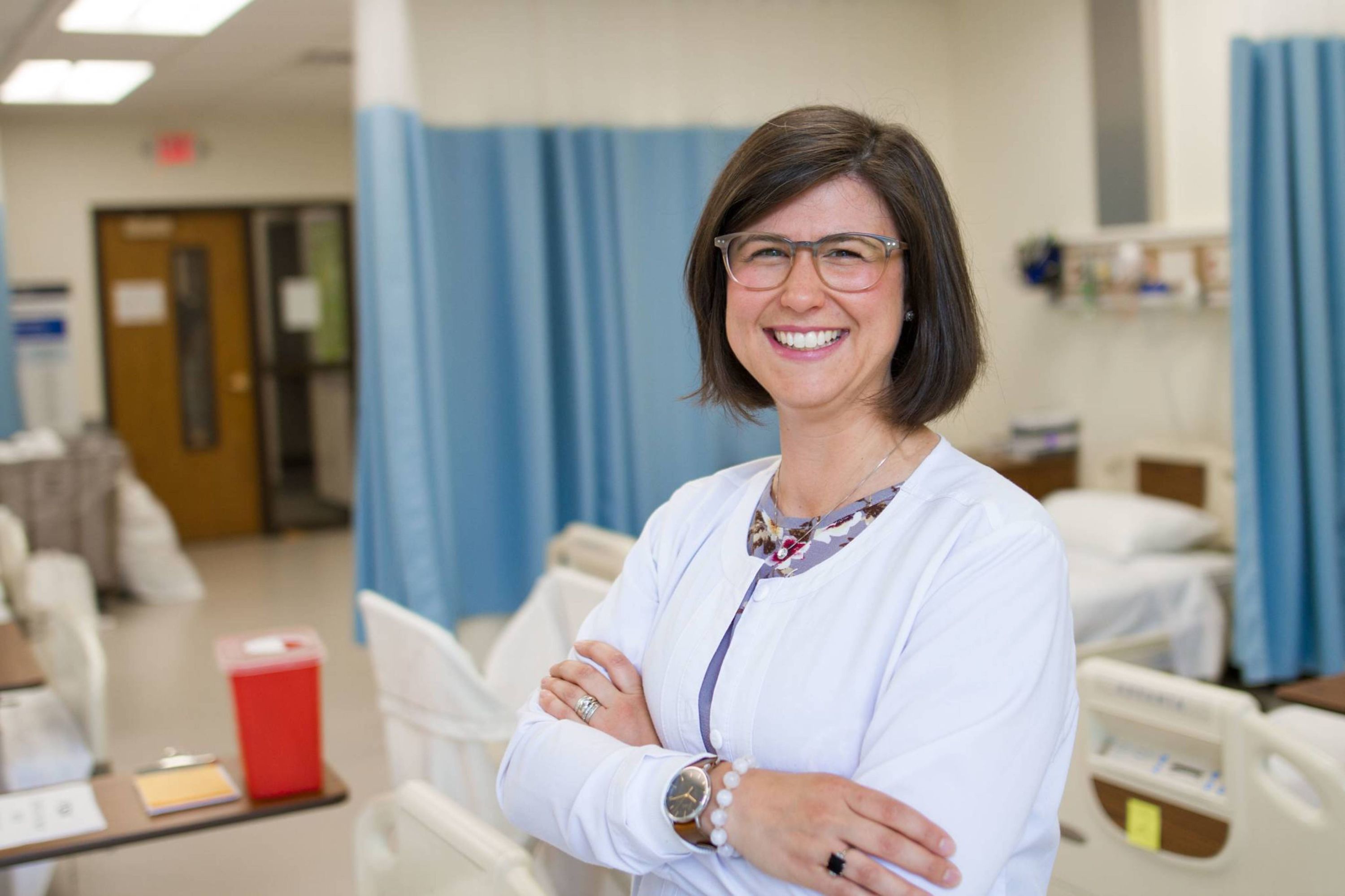 DNP Nursing student in mock hospital room