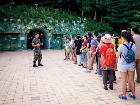 NARPI organizers reach out to military personnel, realizing that they too have their stories to tell. Here 2013 NARPI participants are visiting a site along South Korea's border with North Korea, a heavily militarized region.