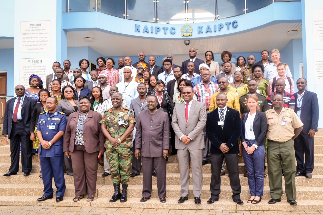 Emmanuel Bombande, MA '02 (front, fourth from right), is flanked by his successor, Chukwuemeka Eze (black jacket), and Kwesi Ahwoi, then Ghana's interior minister, at the opening of WAPI 2013 at the Kofi Annan International Peacekeeping Training Centre in Accra. John Katunga Murhula, MA '05, is on the far left of the photo.