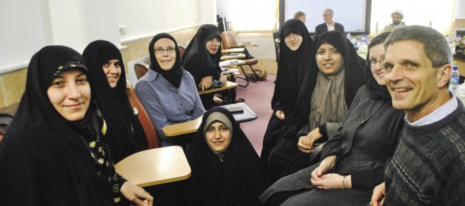 EMU leaders Daryl Byler (right) and Ann Hershberger (center wearing blue) were part of a delegation to Iran in February 2014 that met with women – all scholars at an Islamic seminary – who hope to study at EMU’s Summer Peacebuilding Institute.