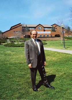 LeRoy Troyer in the winter of 2003-04 before the Campus Center, which he designed.