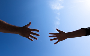 hands reaching toward each other