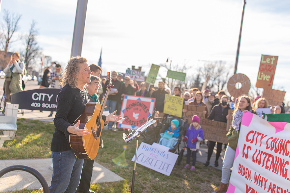 musician leading a protest