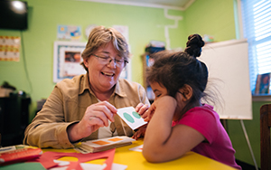 person speaking with a child