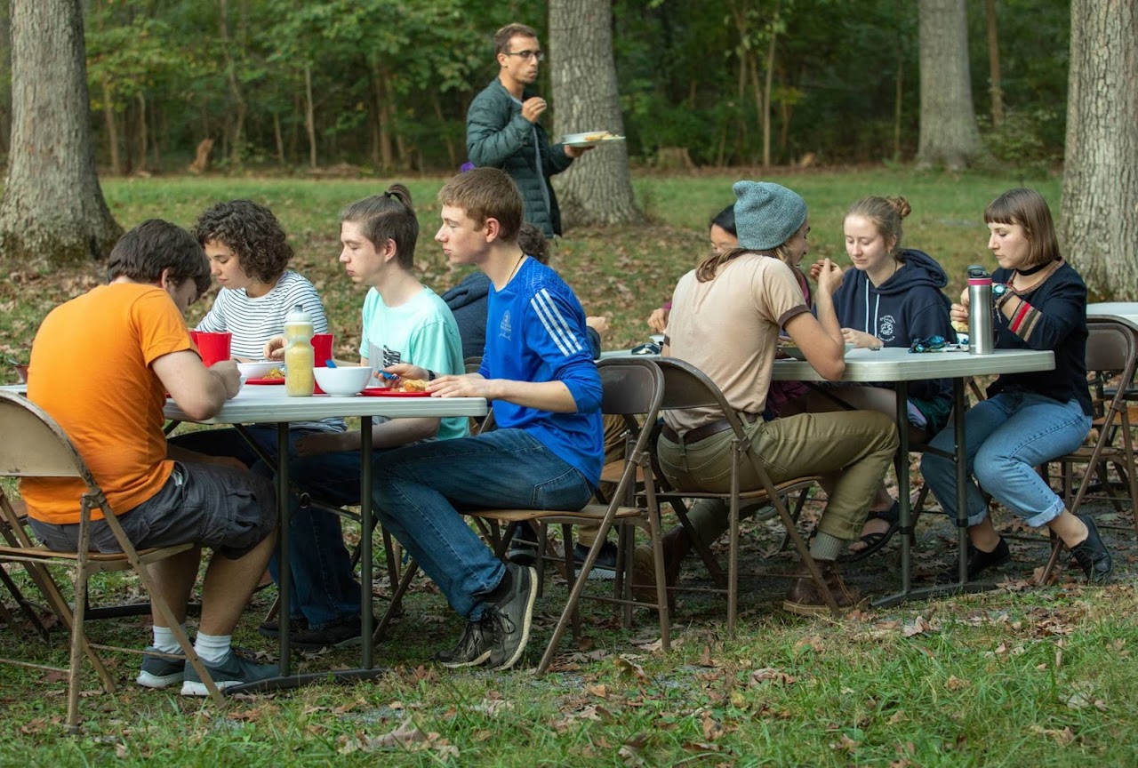 Students gathering in parkwoods for meals