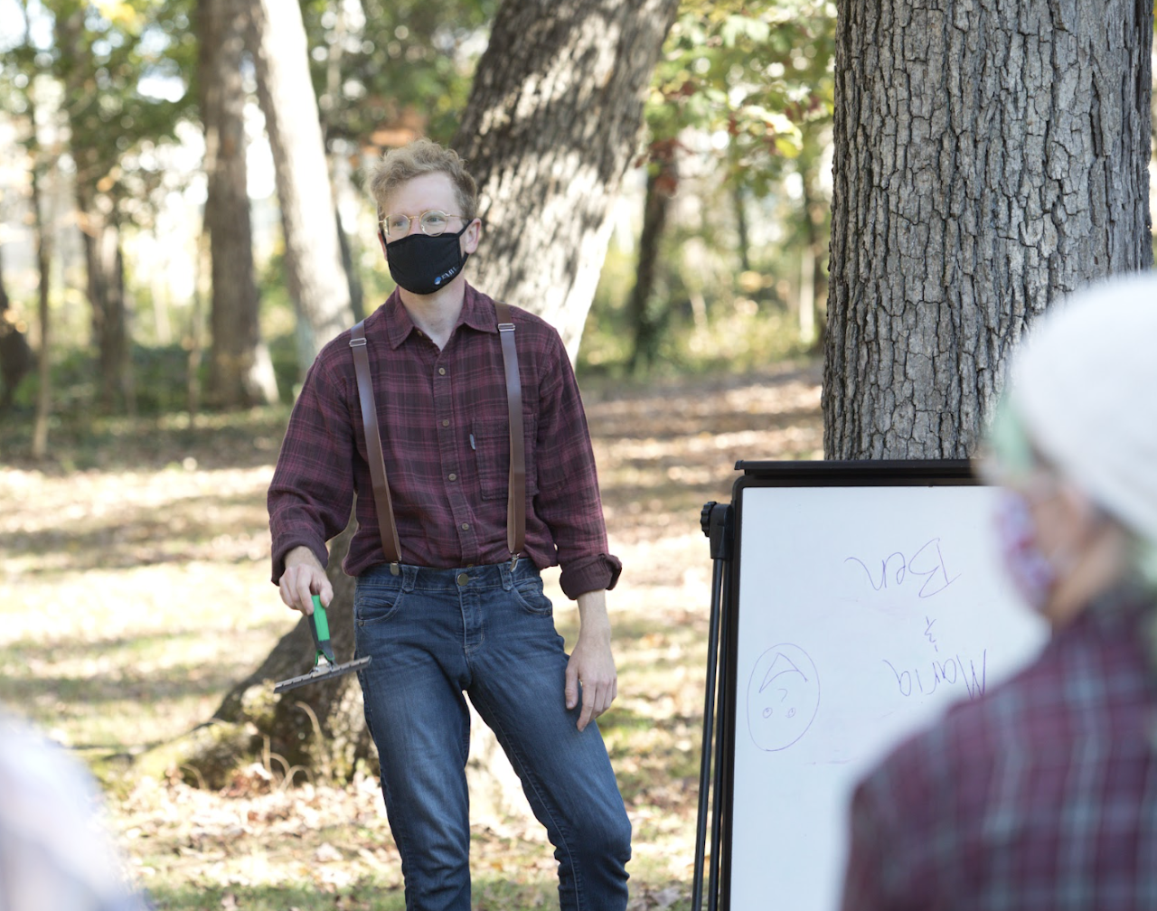 A participant ready to throw an axe