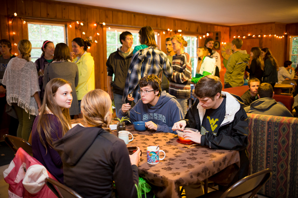 Inside the parkwoods cabin as students gather for a meal