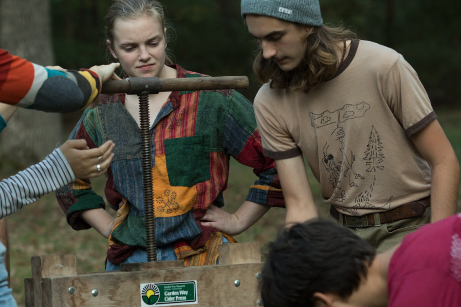 A group of students pressing cider