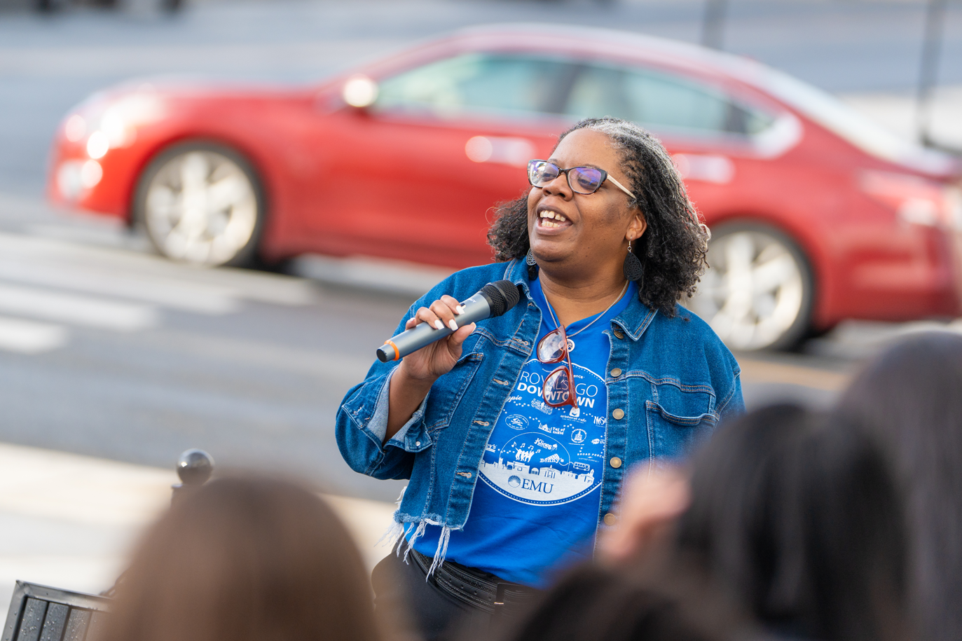 President Rev. Dr. Shannon Dycus speaking to students in downtown Harrisonburg at EMU's Royals Go Downtown event