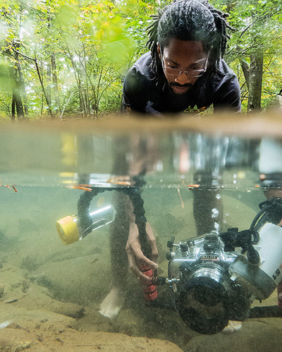 EMU Conservation Photography student with underwater camera
